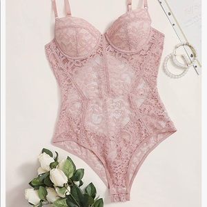 BLACK woman’s sheer floral lace one piece bodysuit. New, never worn. Size small.